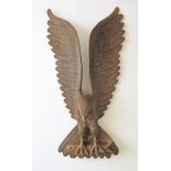 A Chinese or Japanese large carved wooden eagle catching a fish. Both with glass eyes. H630mm,