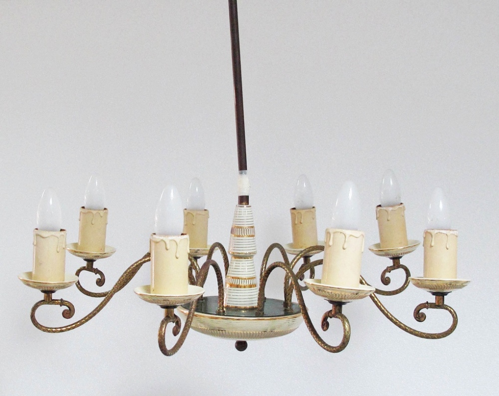 An Italian modern eight light chandelier, c1950, with gilt bronze ‘S’ shaped arms bearing