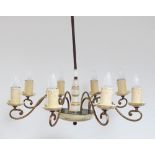 An Italian modern eight light chandelier, c1950, with gilt bronze ‘S’ shaped arms bearing