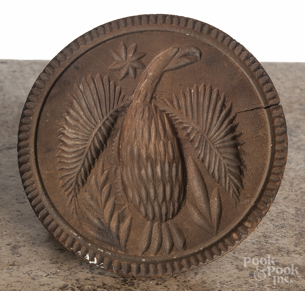 Four carved wood butter prints, 19th c., two with eagle design, largest - 5" dia. Age cracks.  CLICK