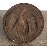 Four carved wood butter prints, 19th c., two with eagle design, largest - 5" dia. Age cracks.  CLICK