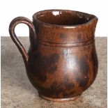 Pennsylvania redware cream pitcher, 19th c., with manganese splotching, 4 1/4" h. Roughness to