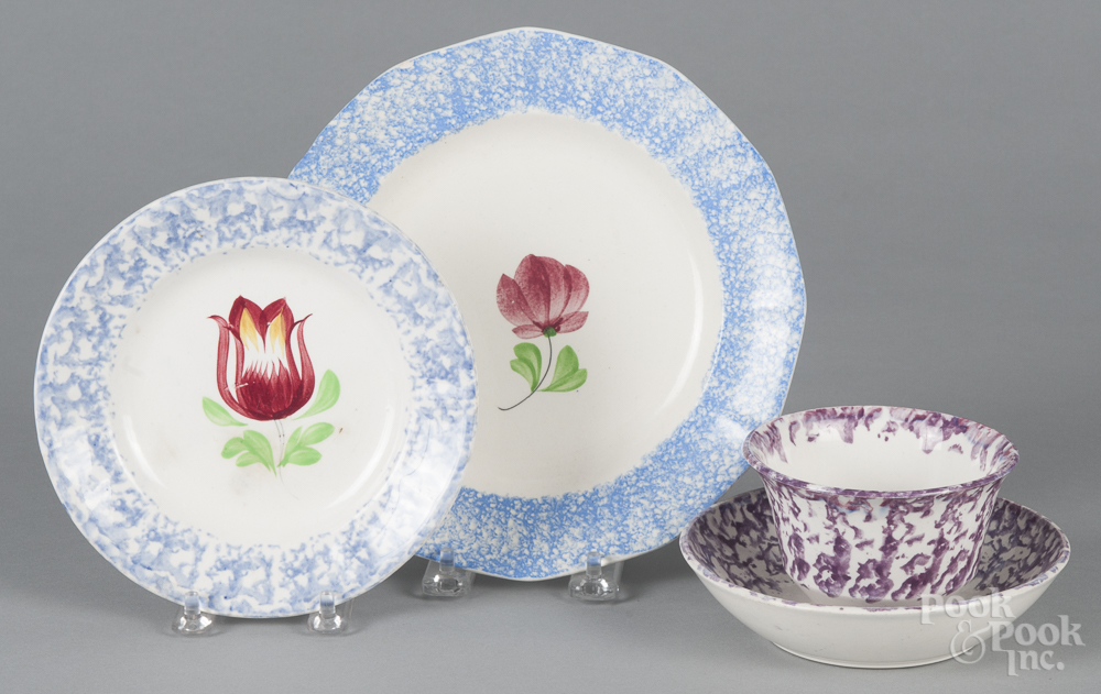 Blue spatterware tulip plate, 19th c., 8 1/4" dia., together with a spongeware tulip plate, 6 1/2"