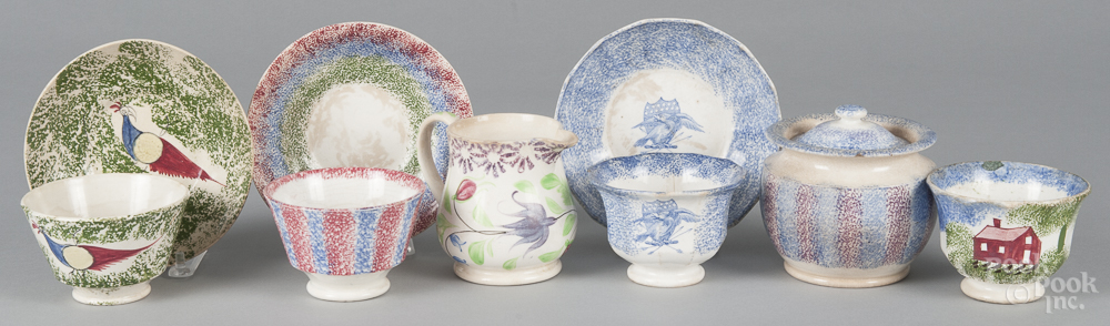 Nine pieces of spatterware porcelain, 19th c., to include a blue and purple rainbow sugar bowl,