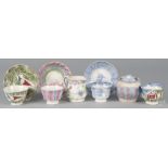 Nine pieces of spatterware porcelain, 19th c., to include a blue and purple rainbow sugar bowl,