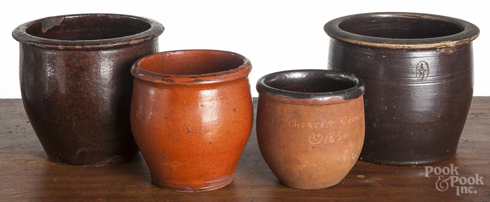 Four Pennsylvania redware pudding crocks, 19th c., one impressed 1/4, tallest - 5". Orange glaze -