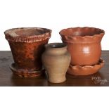 Two redware flowerpots, 20th c., together with a small vase, impressed Hickory, 4" h. Hickory vase -