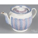 Purple and blue rainbow spatterware teapot, 19th c., 5 3/4" h. Repair to tip of spout  CLICK HERE TO