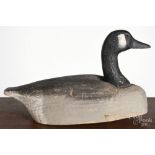 Herters carved and painted goose decoy, mid 20th c., 18" l. All over paint wear, stamped Don