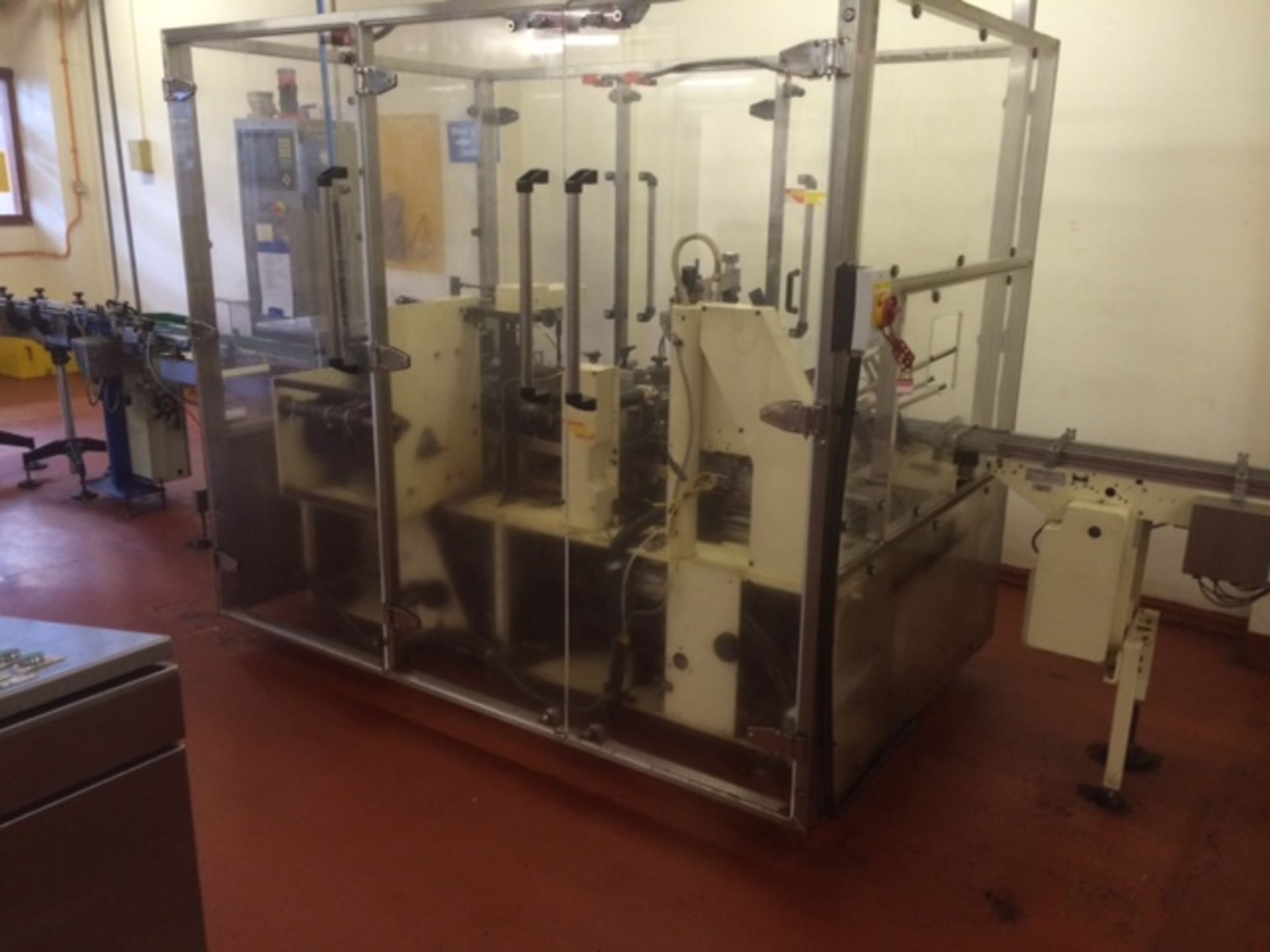 Fabcar cartoning machine, with spray glue unit, forms carton then loads with 12 formed and wrapped