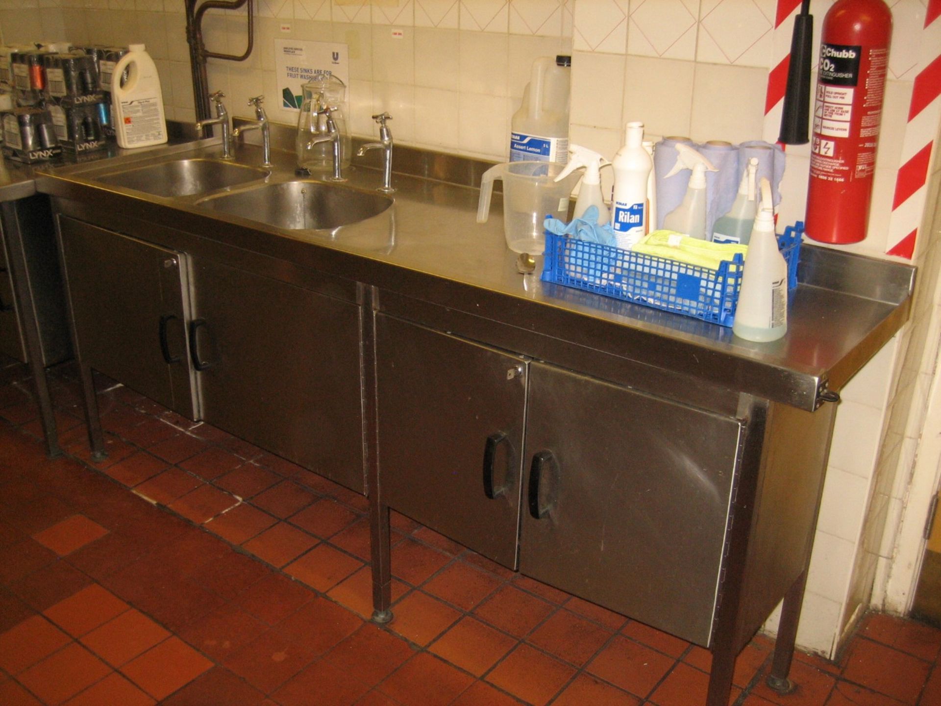 Stainless steel double bowl sink with right hand drainer and 2 double door cupboards. 2100mm x 700mm