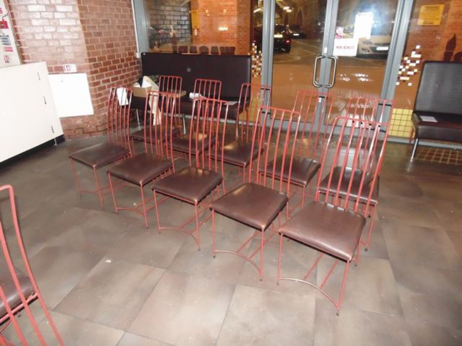 A set of 10 x dining chairs faux leather padded seat 400mm pitch with red galvanised metal frame