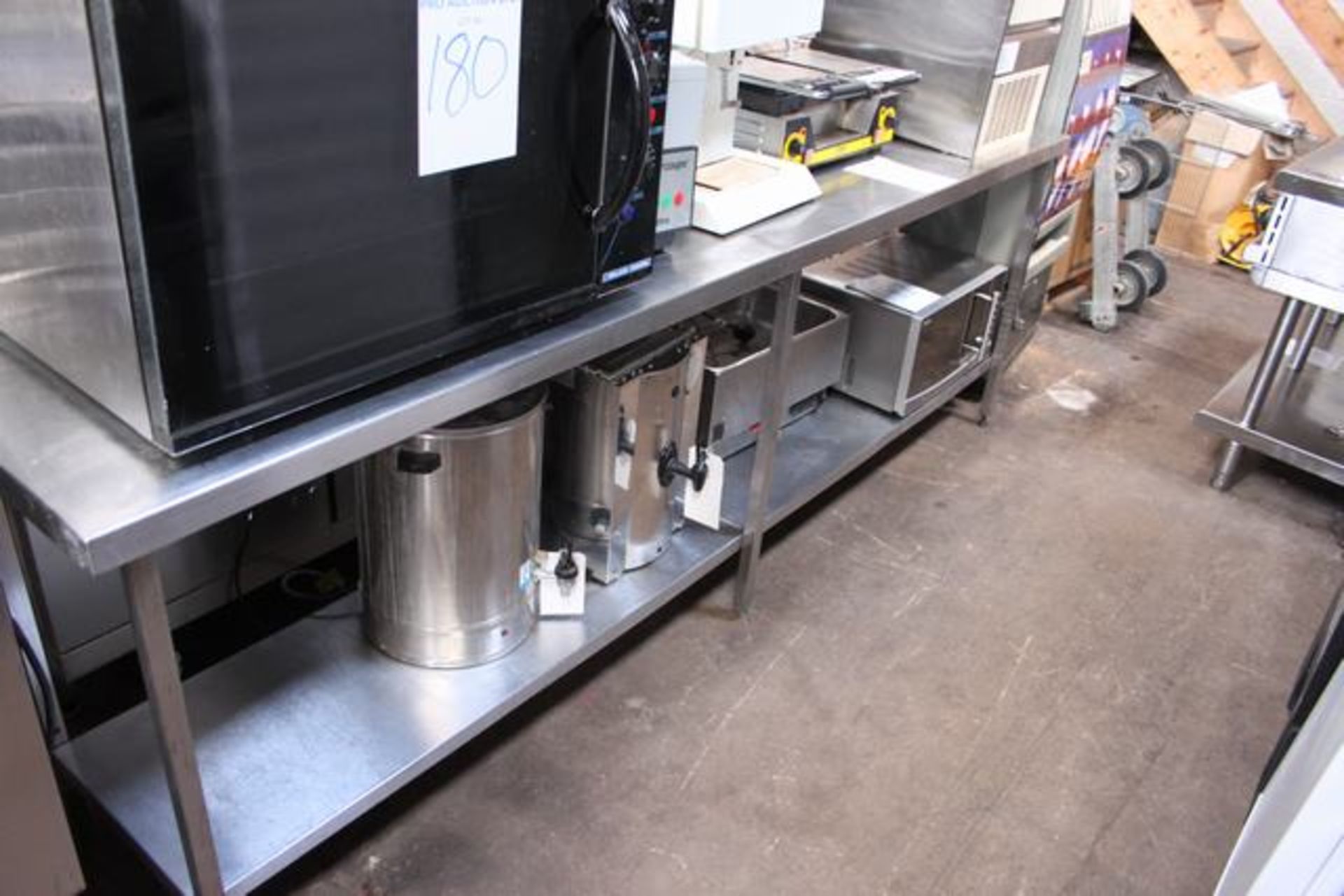 Stainless steel table with back splash and under shelf 2700mm x 600mm