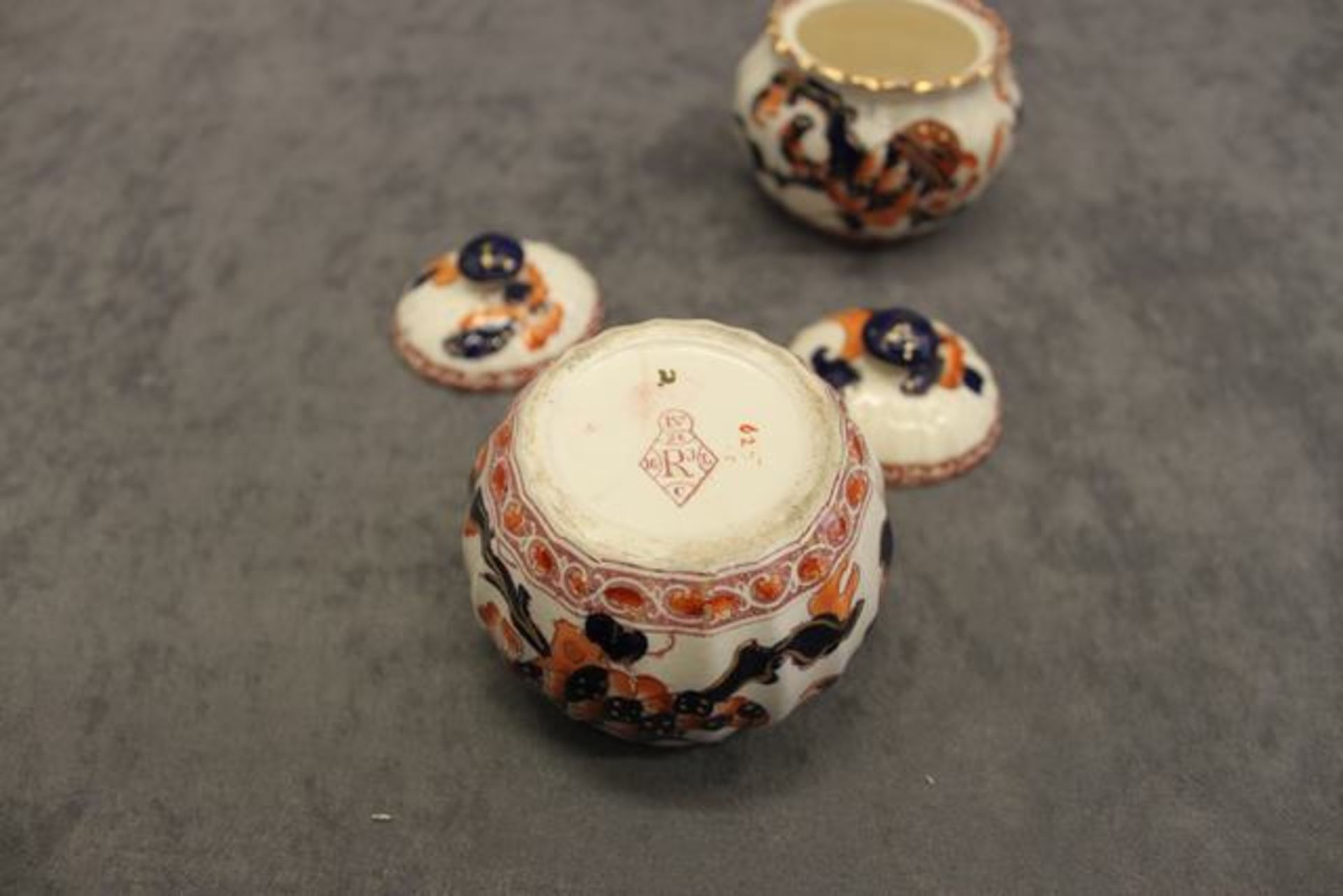 A pair of Royal Doulton lidded pots, decorated in cobalt blue & burnt orange with gilt highlighting, - Image 3 of 4