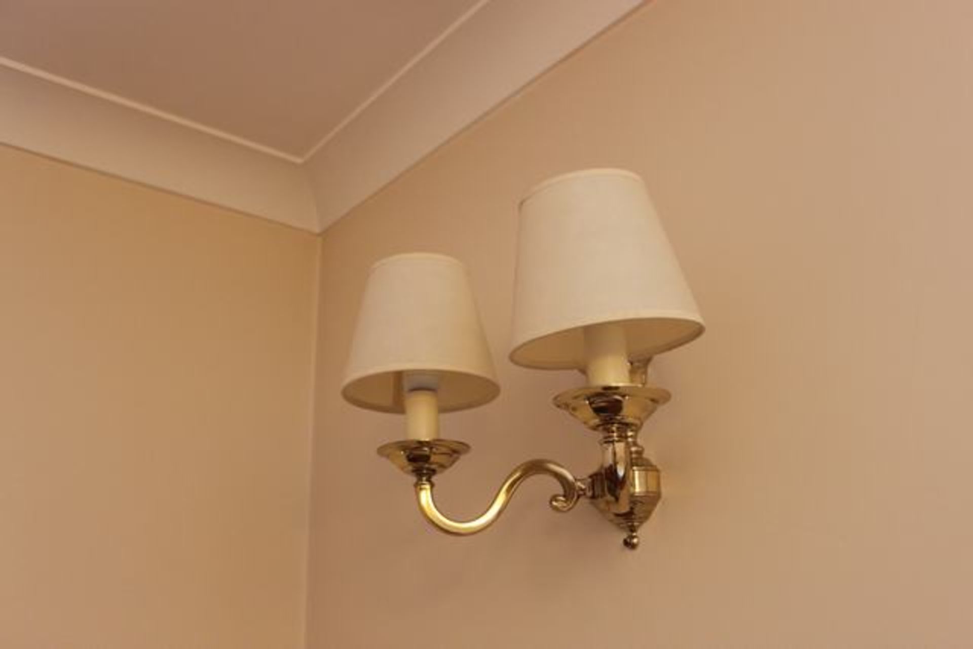 A pair of Chelsom Lighting polished brass wall sconces  Location 49Lift out charge  5