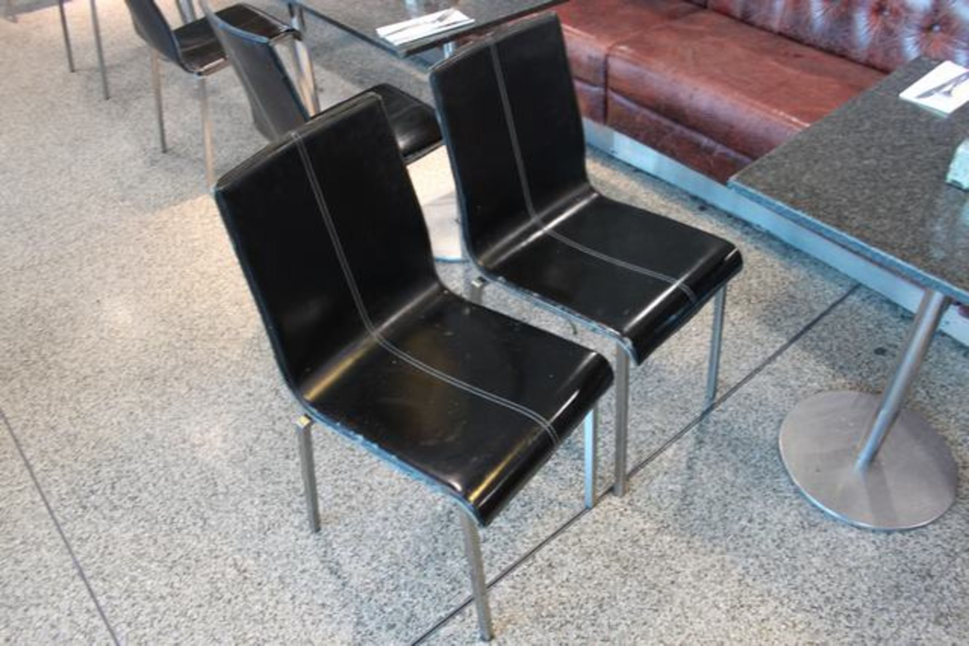 7 x black leather look chairs with chrome metal legs