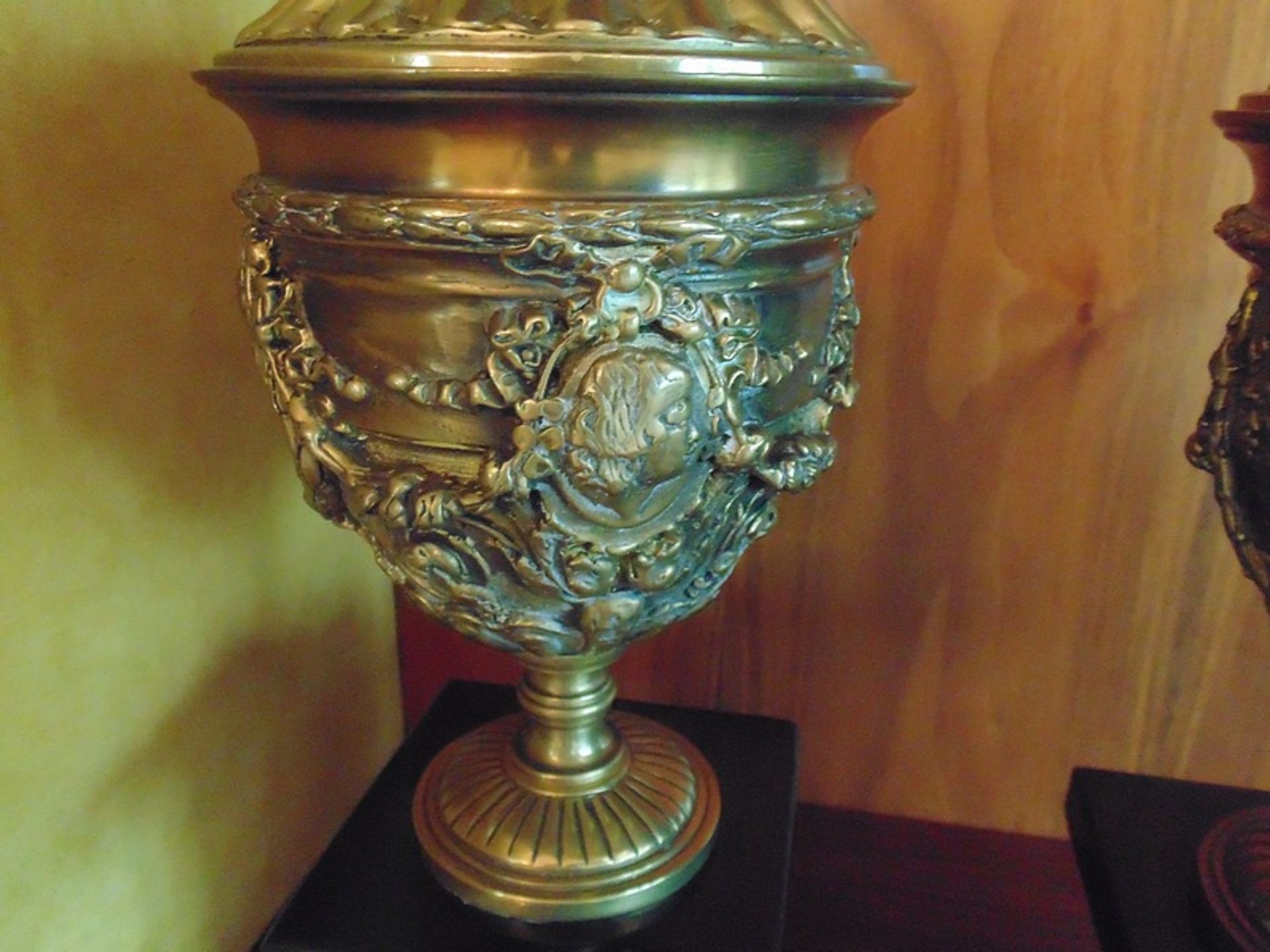 A pair of Italian Neoclassical gilt bronze urns cast in relief mounted on a black marble plinth - Image 3 of 3