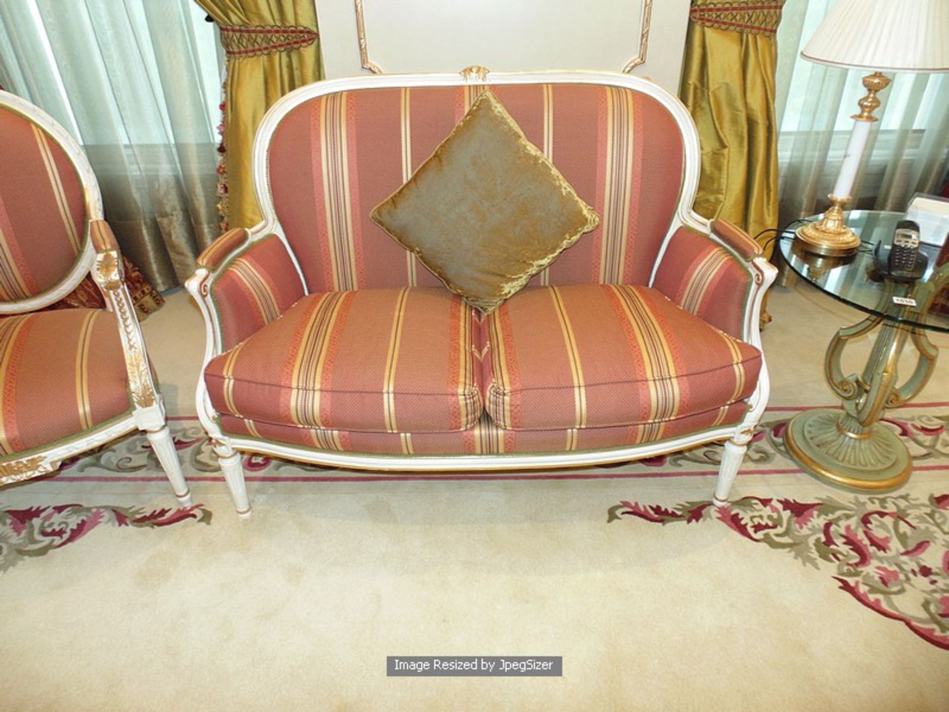 A Neoclassical salon painted and gilt suite comprising of a sofa, and a fauteuil arm chair and - Image 2 of 2