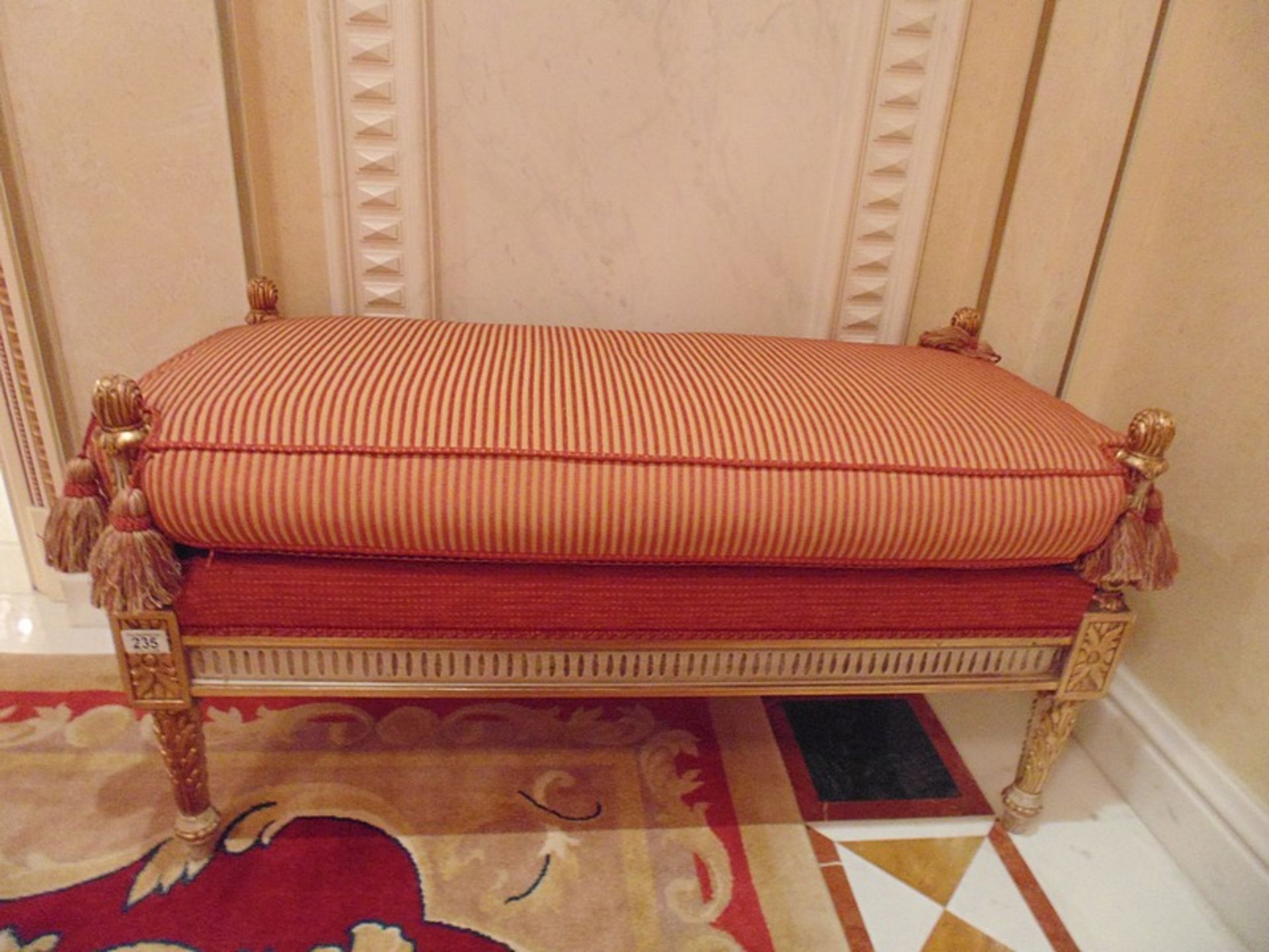 Italian Neoclassical style carved and gilt wood upholstered window bench leaf and ribbon carved