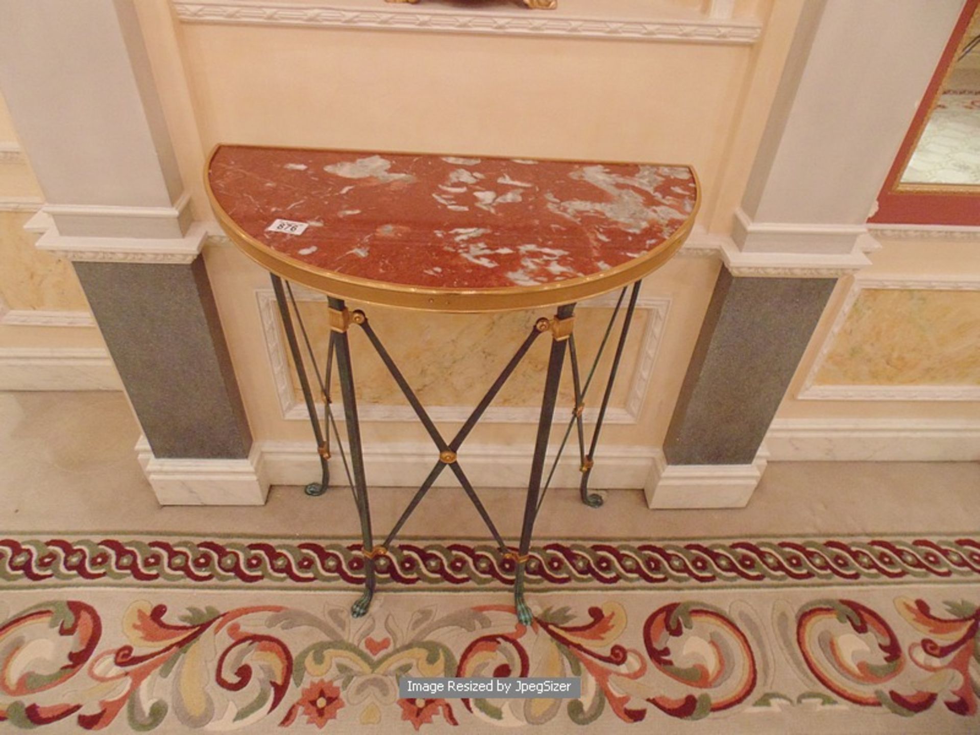 Neoclassical bronze gueridon table with inset marble tops, raised on straight legs and animal paw