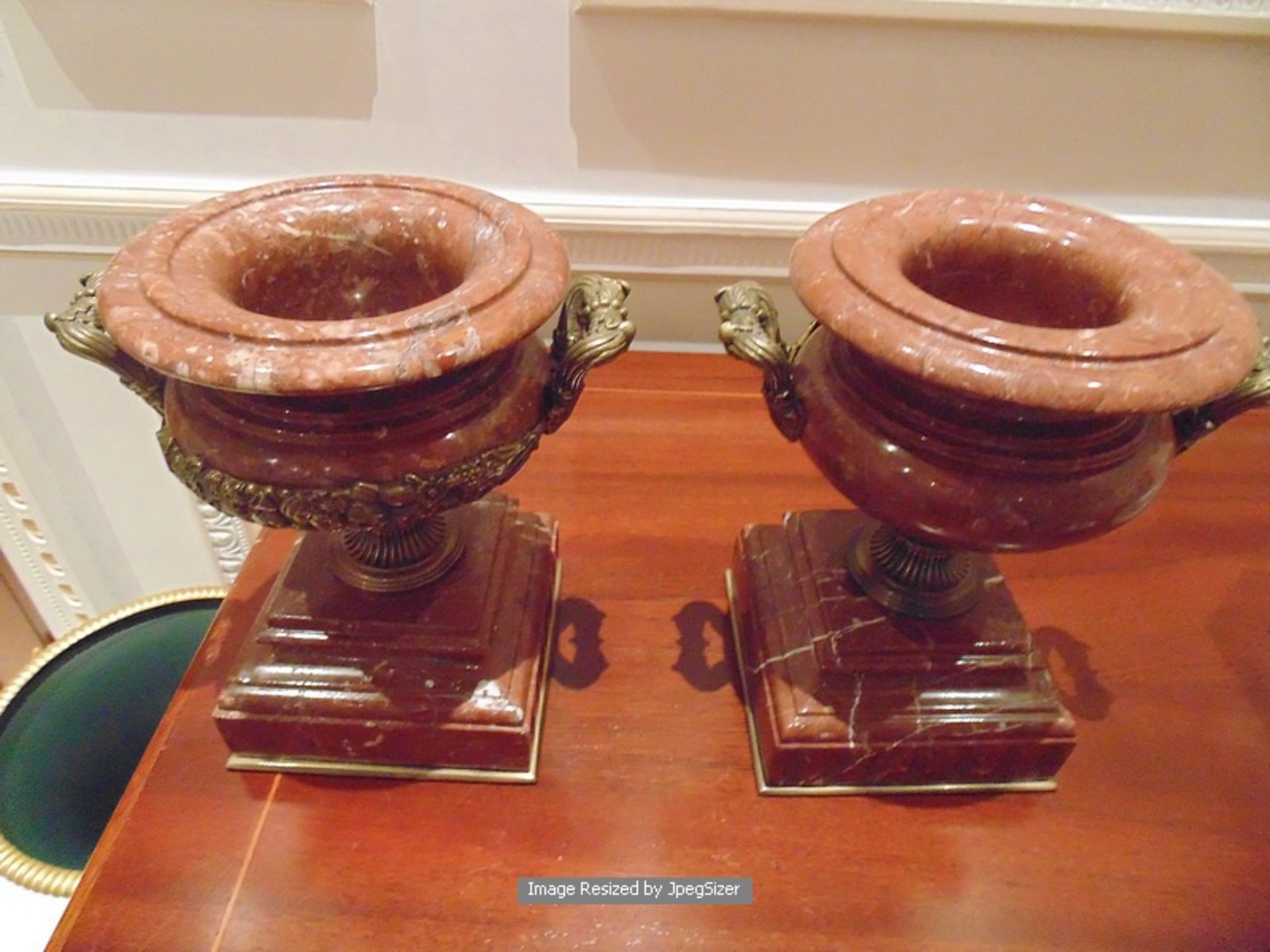 A pair of marble and bronze decorated urns 250mm wide