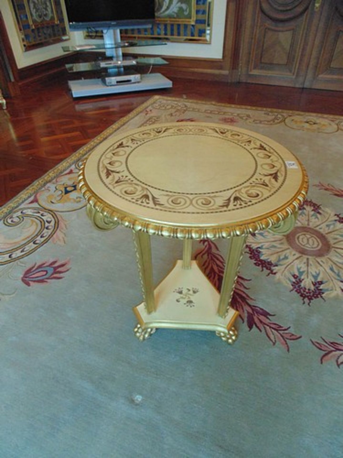 Continental parcel wood centre table 620mm diameter the top with floral motif mounted over three