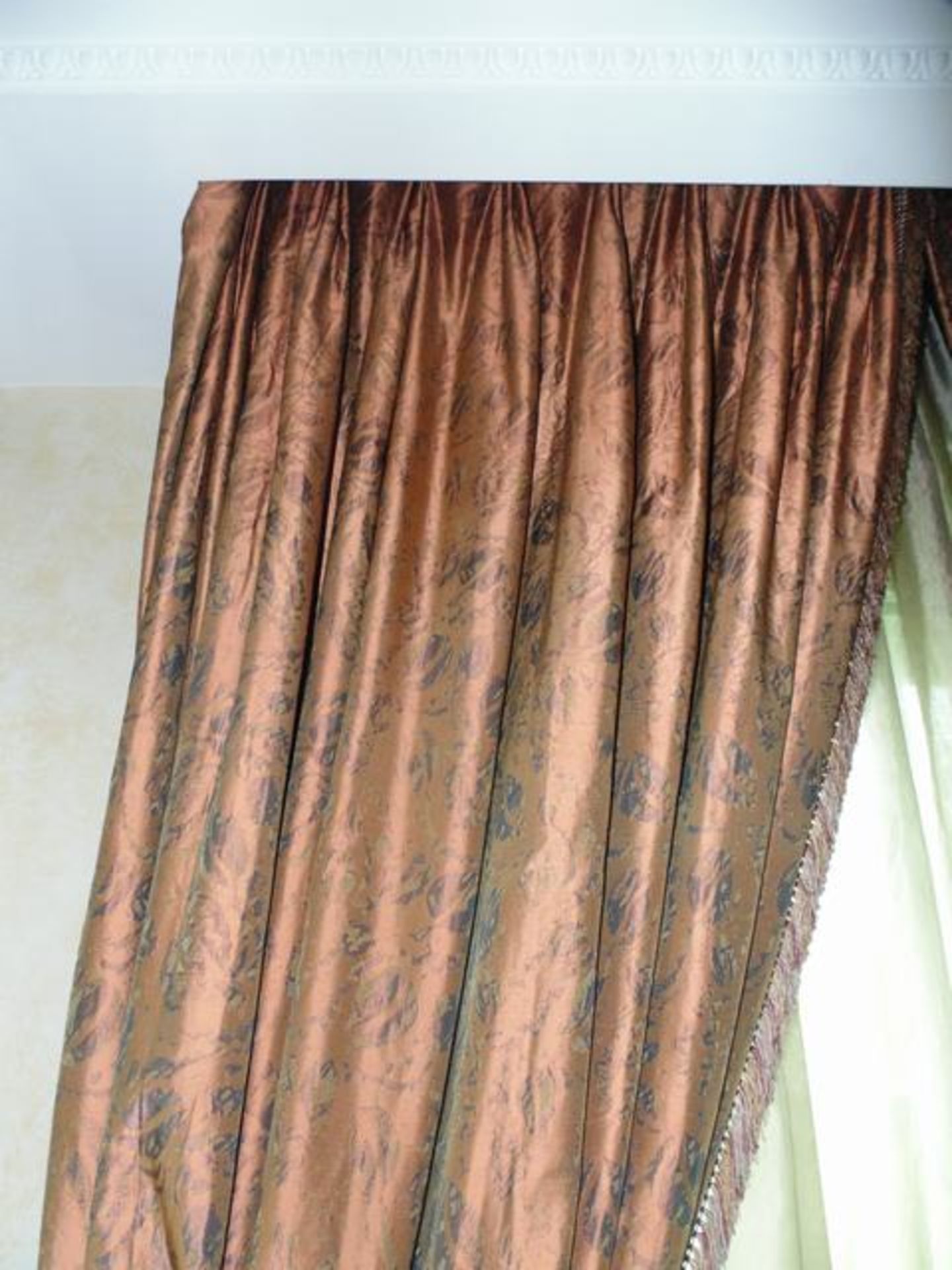 A pair of gold bronzed curtains supplied by Jacquard, gold fabric from Marvi complete with decorated