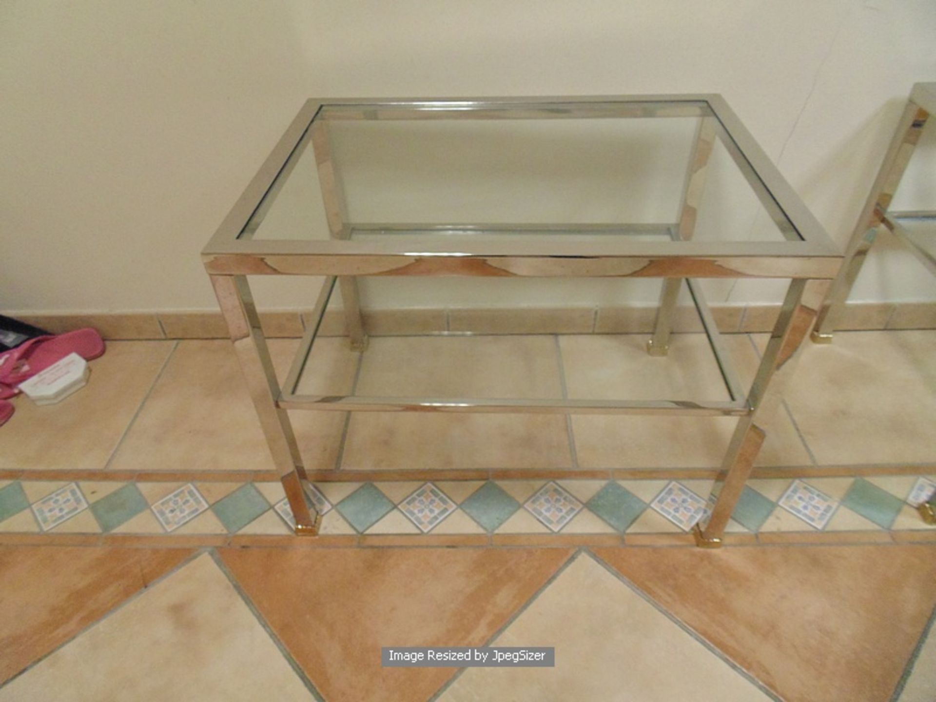 Silvered two tier coffee table loosely based on the design of Pierre Vandel table, with bronzed