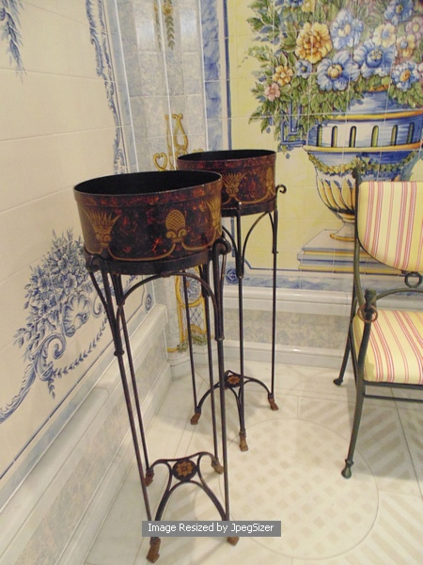 A pair of Empire style cast metal jardinière stands with a painted tin basket above 930mm tall