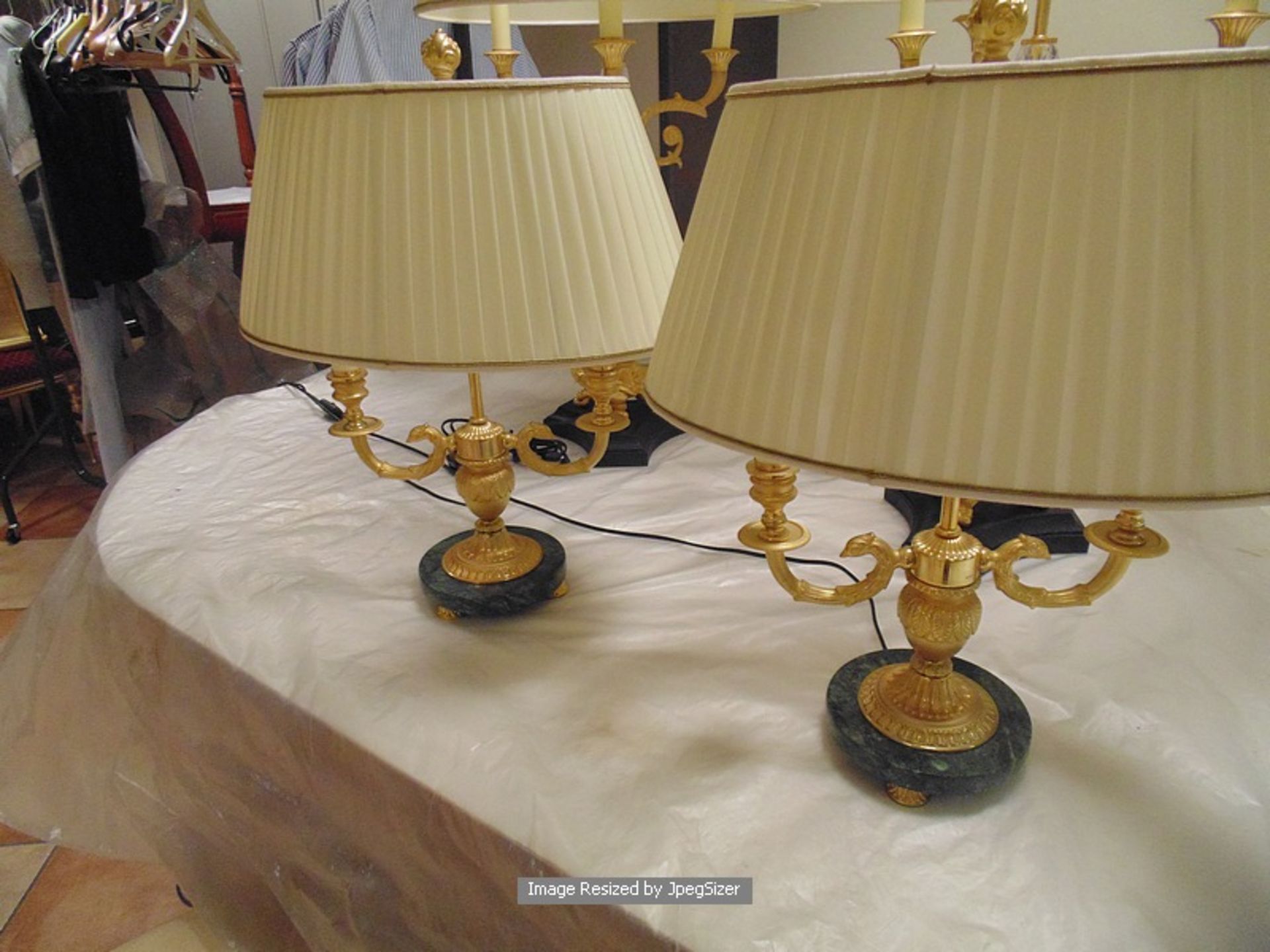 A pair of two candle Laudarte Nicippe table lamps, bronze castings with central column 24ct. gold