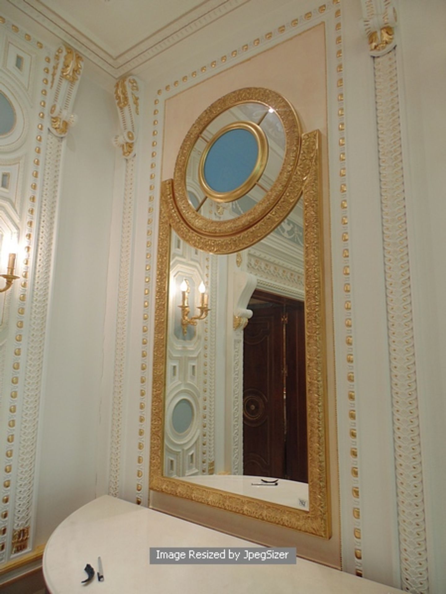 A neoclassical style carved and gilded mirror, a two part mirror with the main frame of the mirror - Image 2 of 2