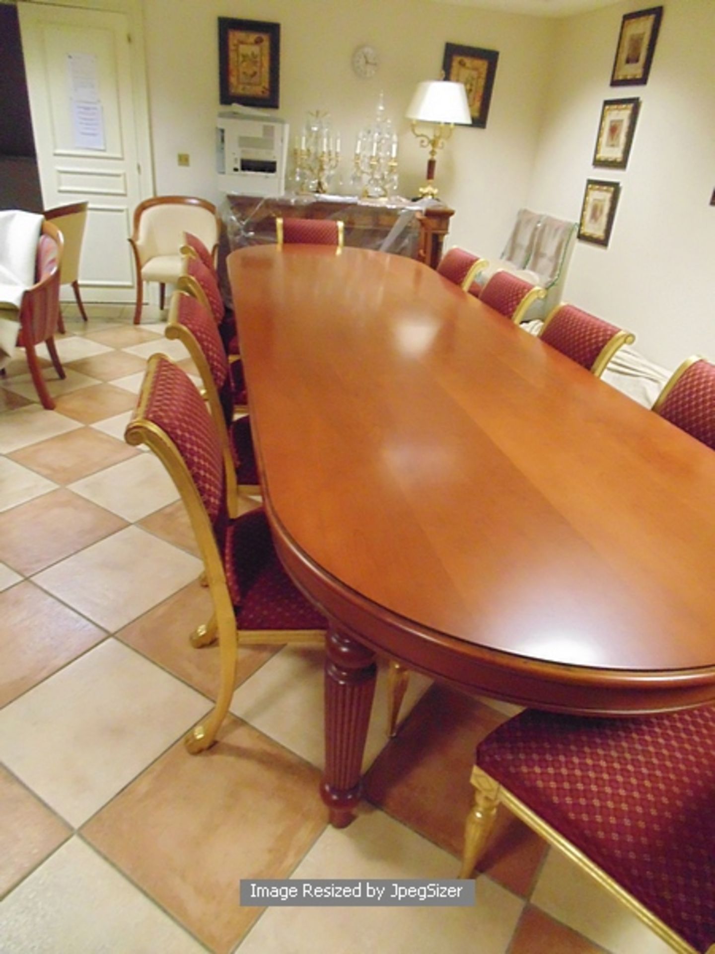 A Georgian style mahogany dining table, the rectangular shape with D-shaped overlapping ends