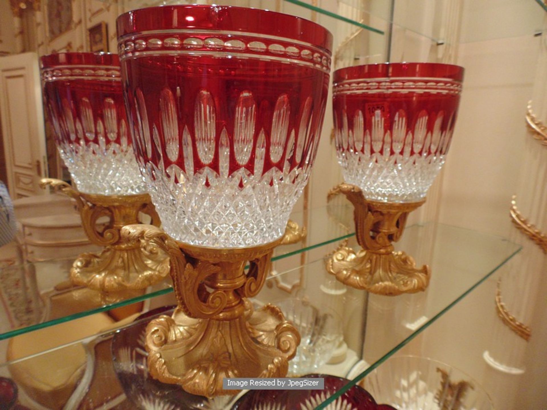 A pair of Baldi Home Jewels stunning ruby red and clear crystal vases mounted on bronze figural