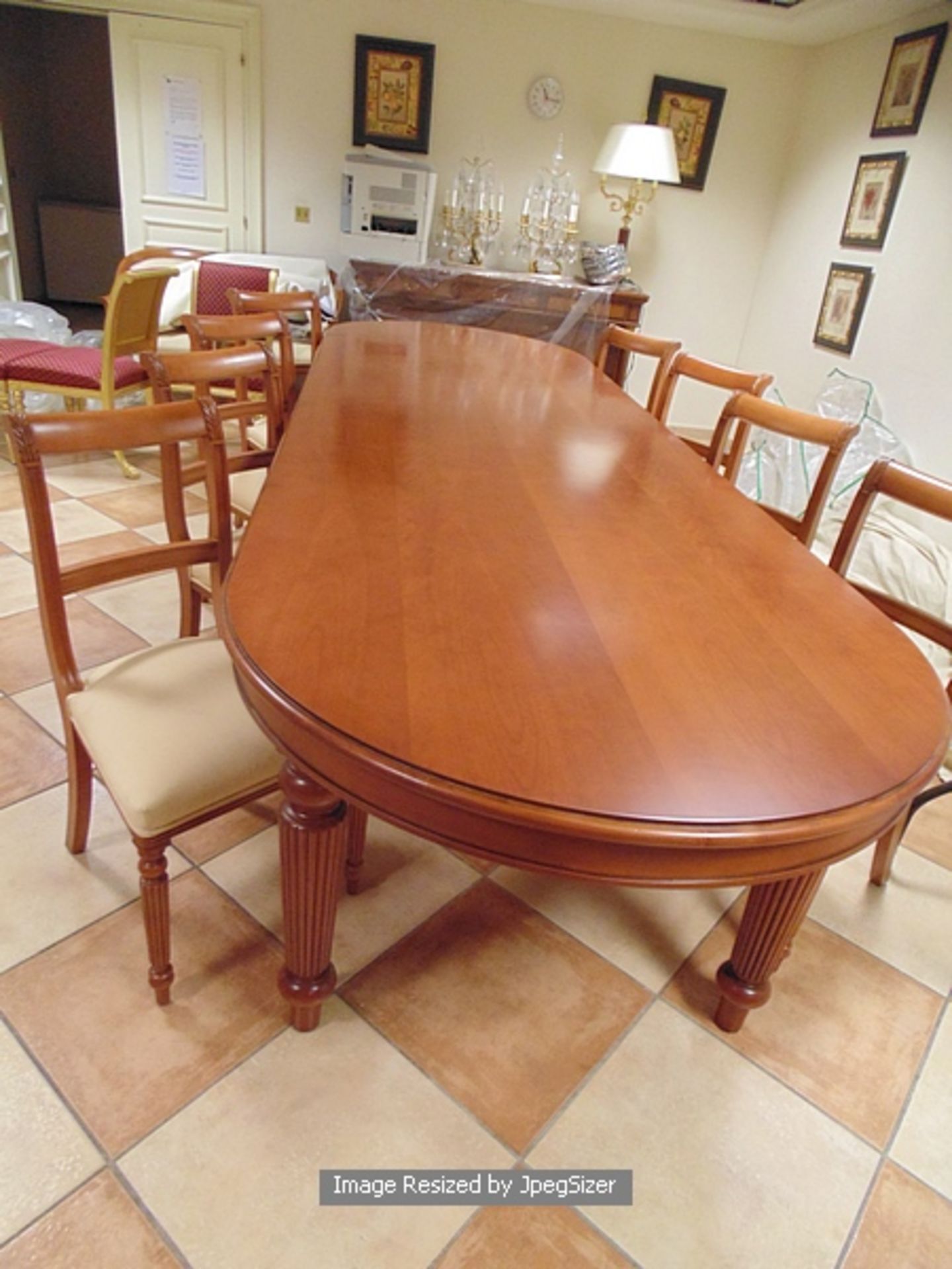 A Georgian style mahogany dining table, the rectangular shape with D-shaped overlapping ends