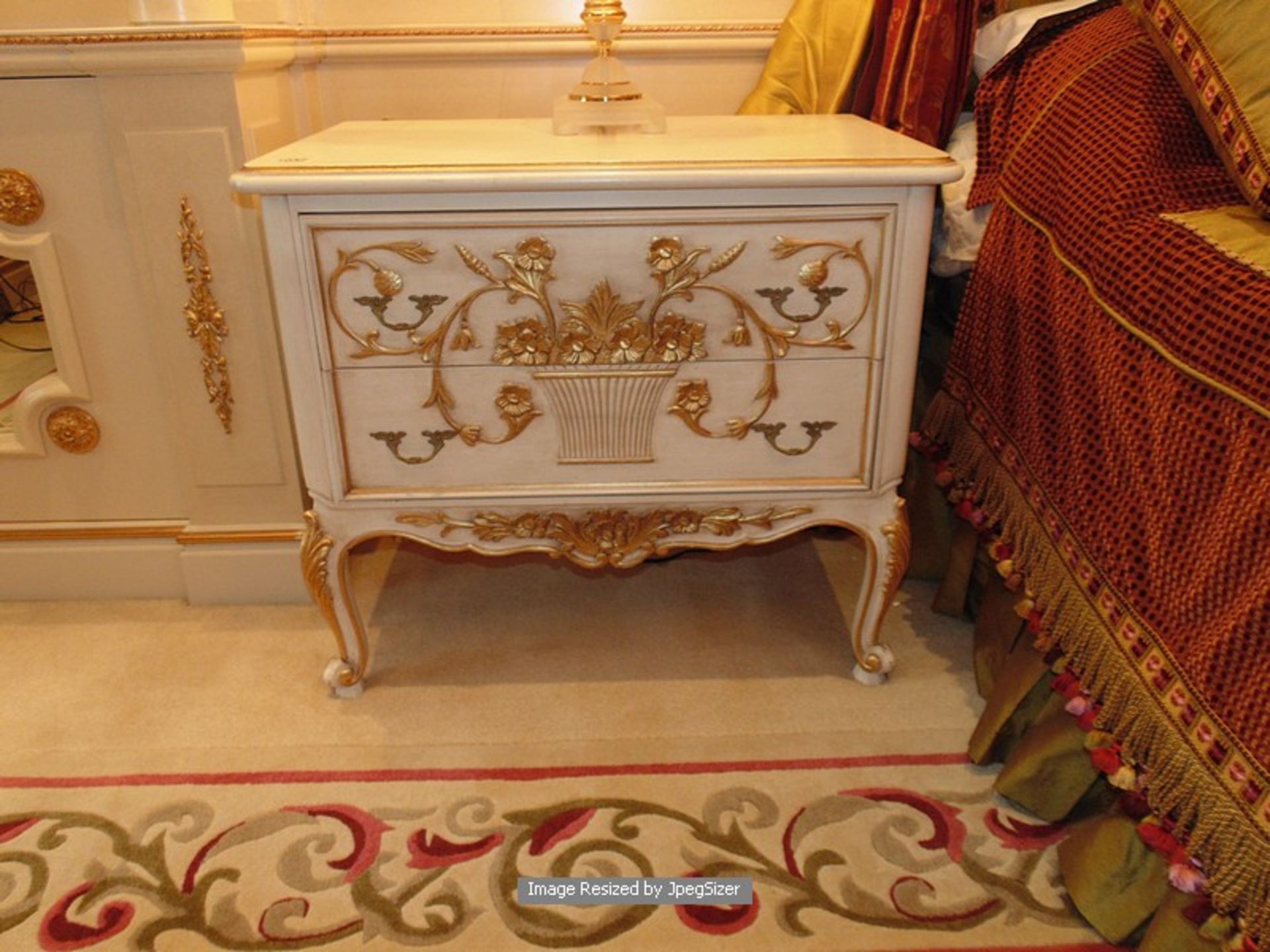 A pair of Neoclassical style nightstands, the two drawers and apron is finely carved with