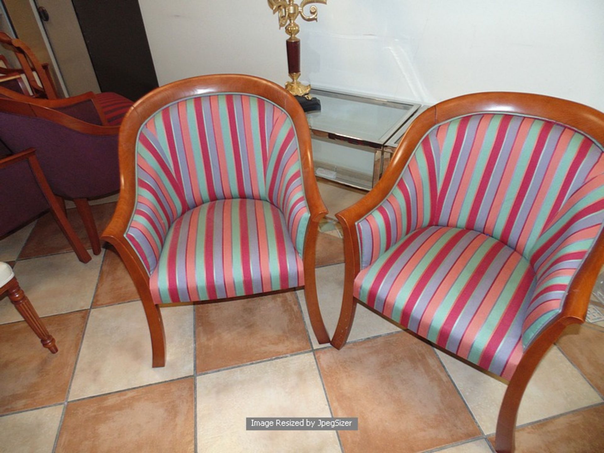 A pair of polished mahogany framed upholstered club chairs multistripe satin type fabric