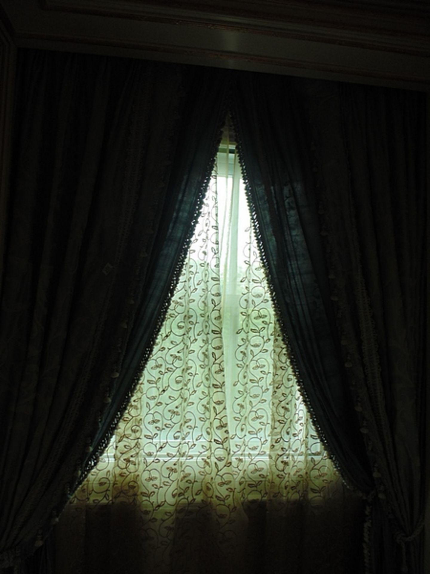 A pair of blue and gold curtains supplied by Jacquard, blue and gold fabric from Marvi complete with