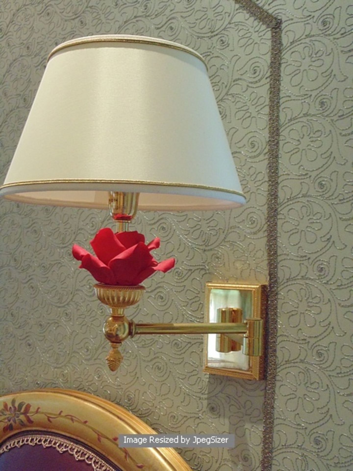 A pair of Laudarte T420 cantilever wall sconces bronze castings, with Capodimonte roses in red 24ct.