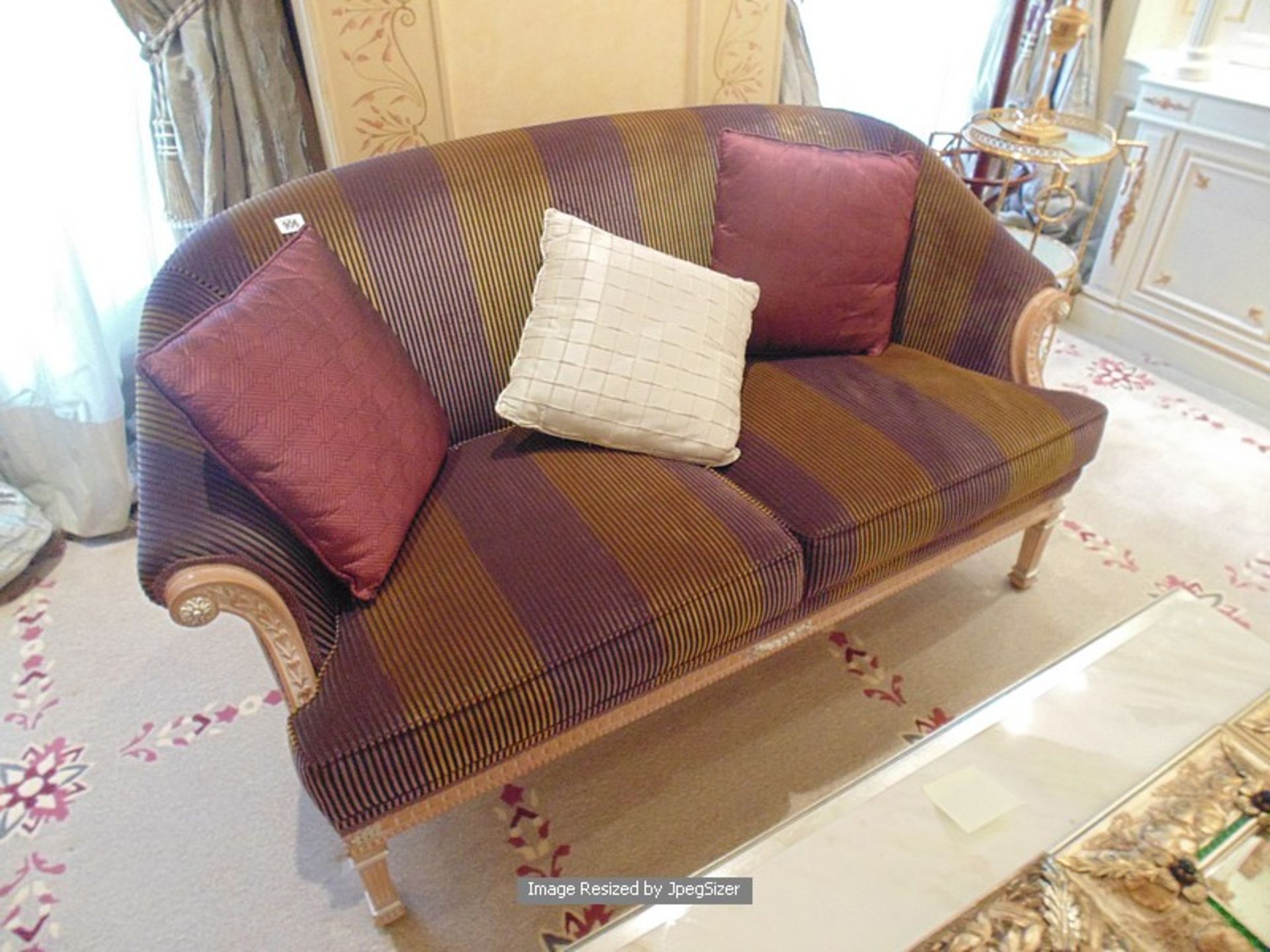 Neoclassical Italian painted and parcel gilt two seater sofa with loose cushions striped mauve and