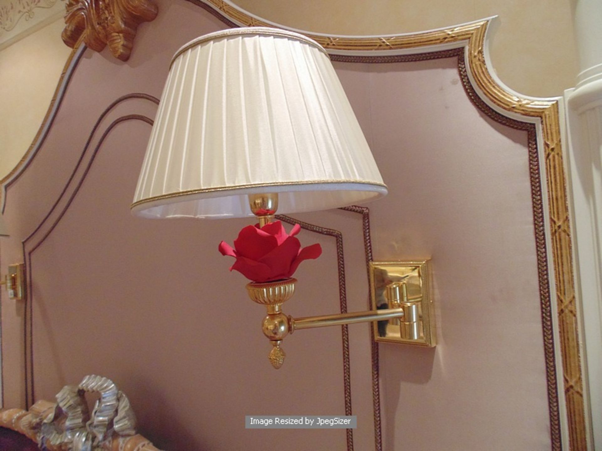 A pair of Laudarte T420 cantilever wall sconces bronze castings, with Capodimonte roses in red 24ct.