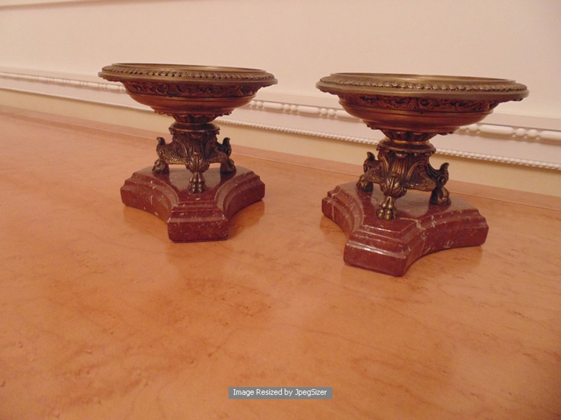 A pair of bronze Tazza on a tri-form marble base 120mm tall