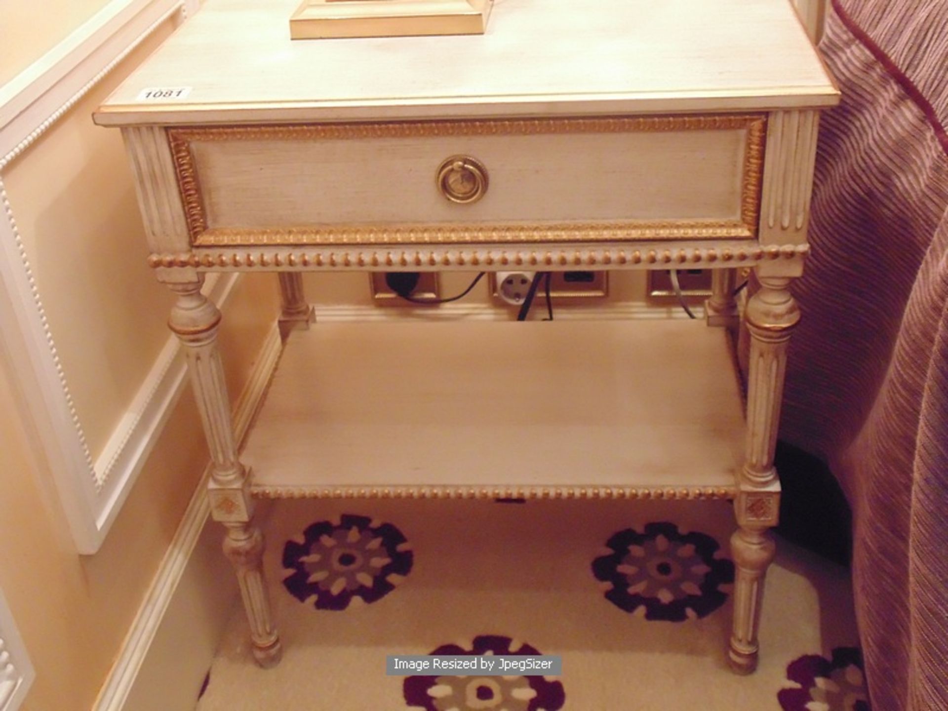 A pair of Neoclassical Italian painted and parcel gilt single drawer nightstand with under shelf