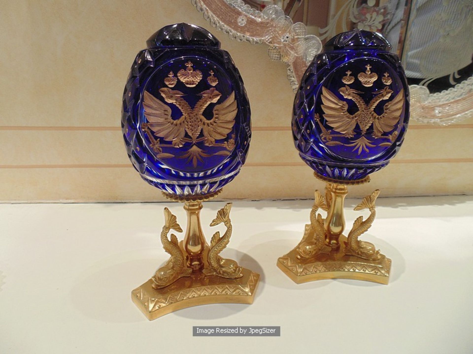 A pair of Baldi Home Jewels The Grand Romanov Double Eagle Egg, the heavily cut crystal egg