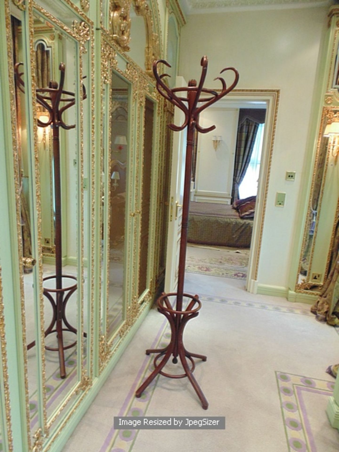 A mahogany coat and umbrella stand with a six crown top 1900mm tall