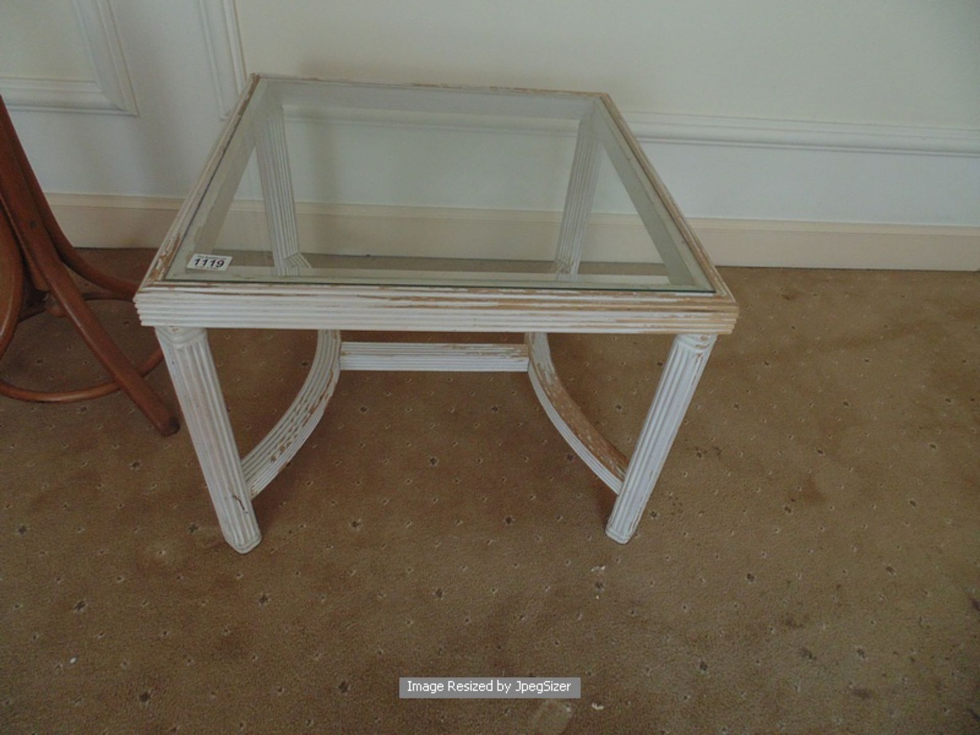 A painted distressed wood glass top coffee table on arched stretcher 610mm x 610mm