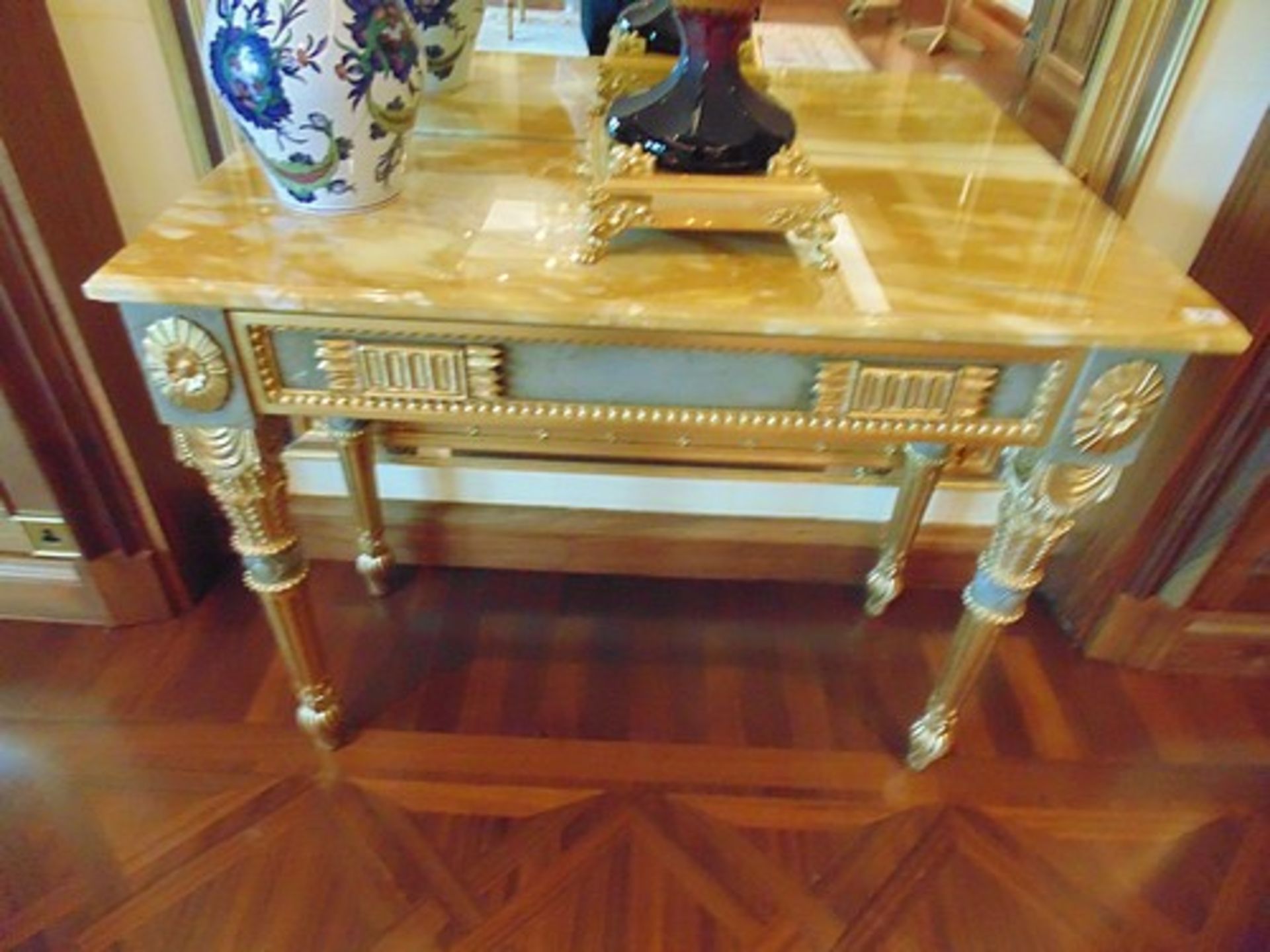 Neoclassical Italian painted and parcel gilt console with marble top, applied medallions detail on