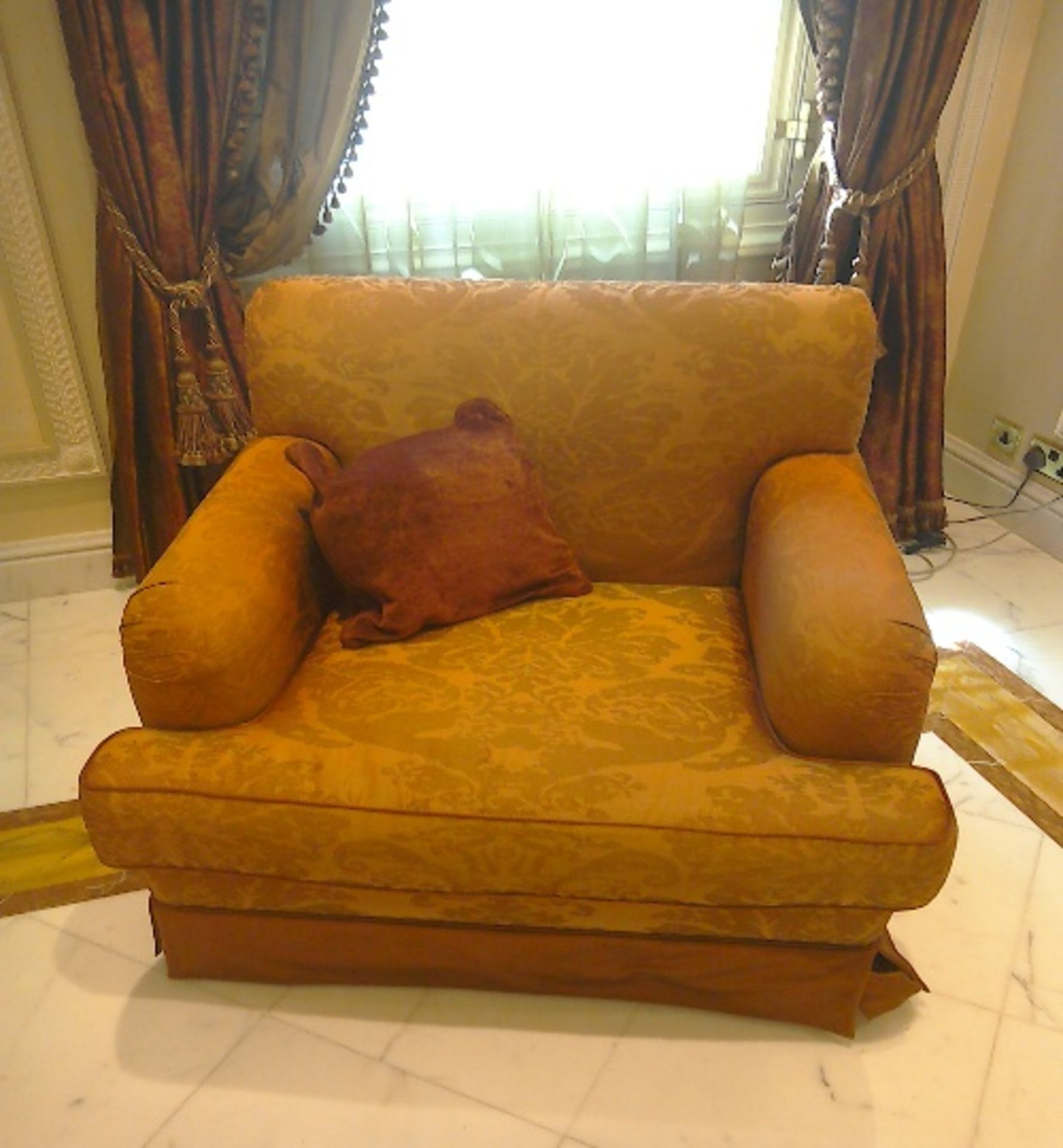 A pair of bronze coloured  upholstered arm chairs