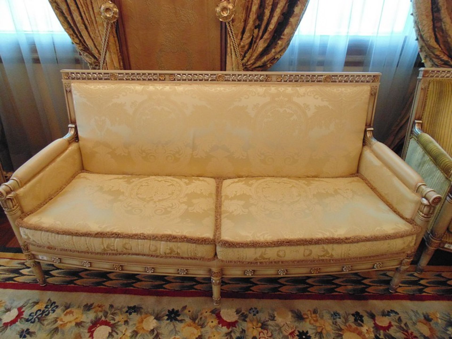 French Directoire Style Settee the rectilinear back has gilded foliage relief and the sides
