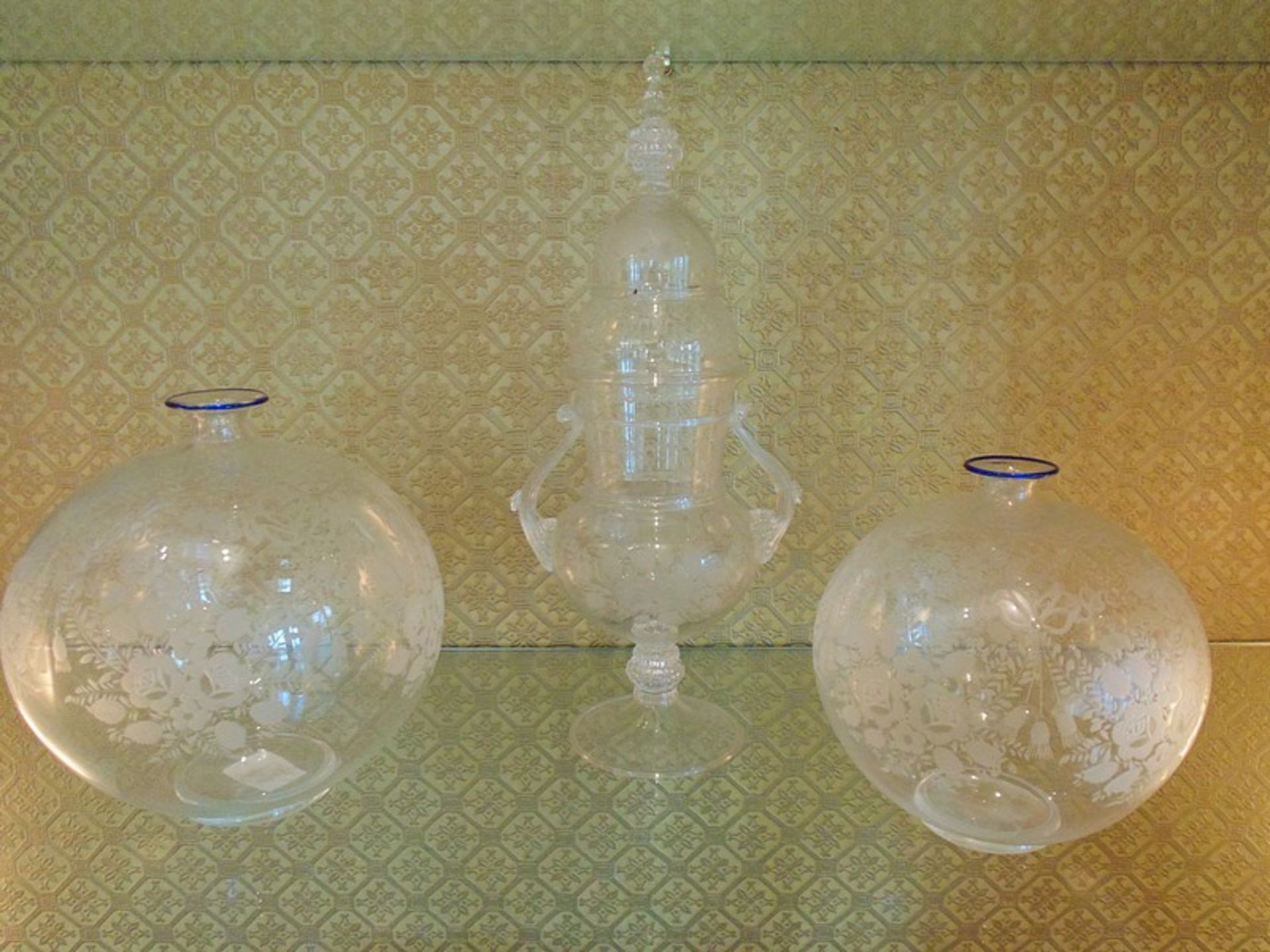 A fine blown etched glass candy jar with a pair of fine etched glass bowls