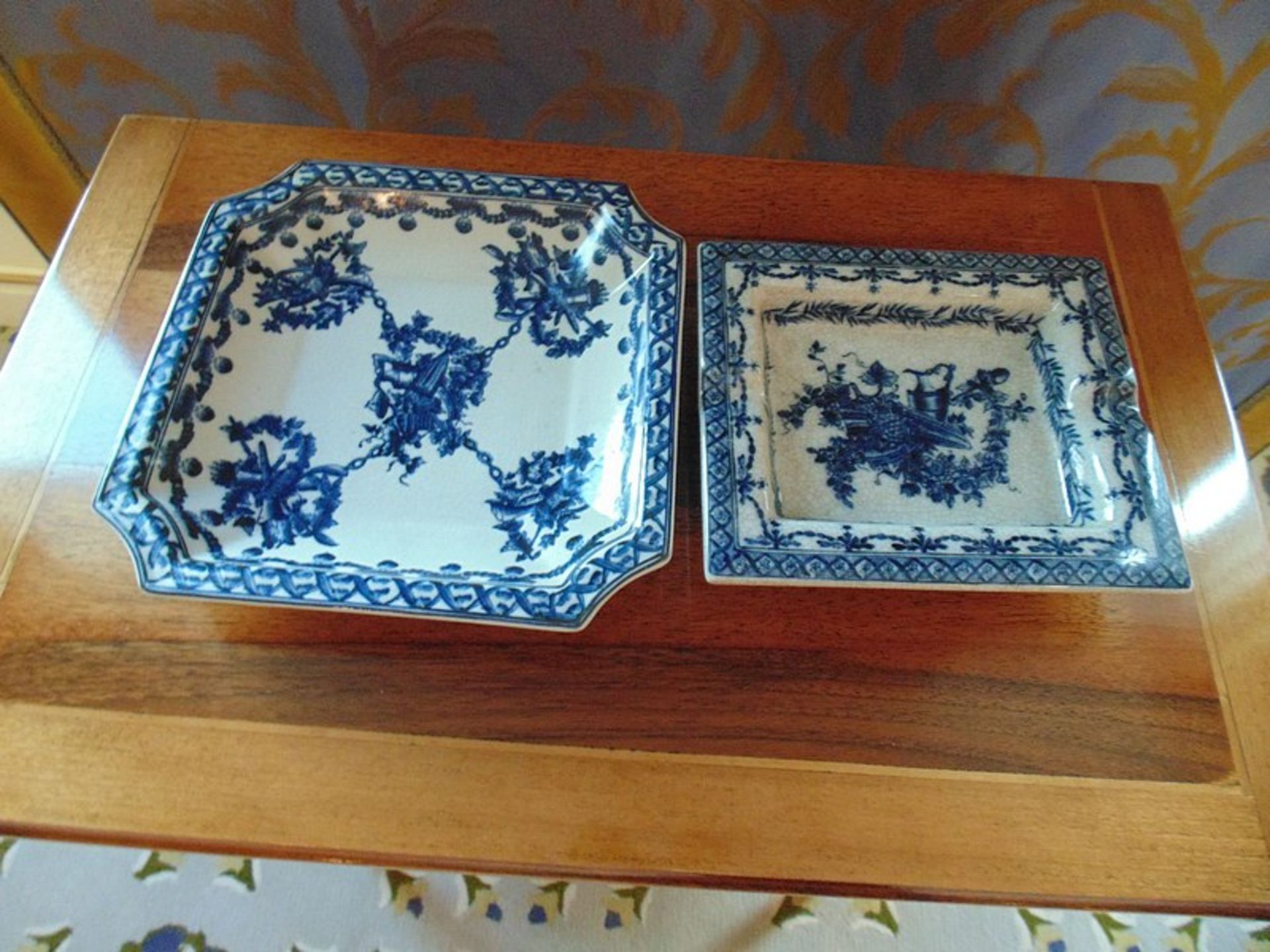 A blue and white ceramic shallow dish and of similar style ashtray with a crackle ware finish